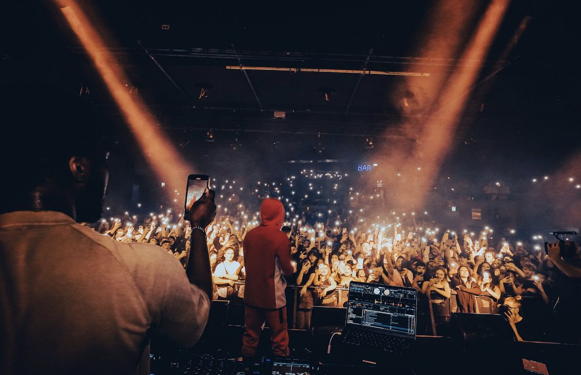 Speed performing on stage to a packed crowd