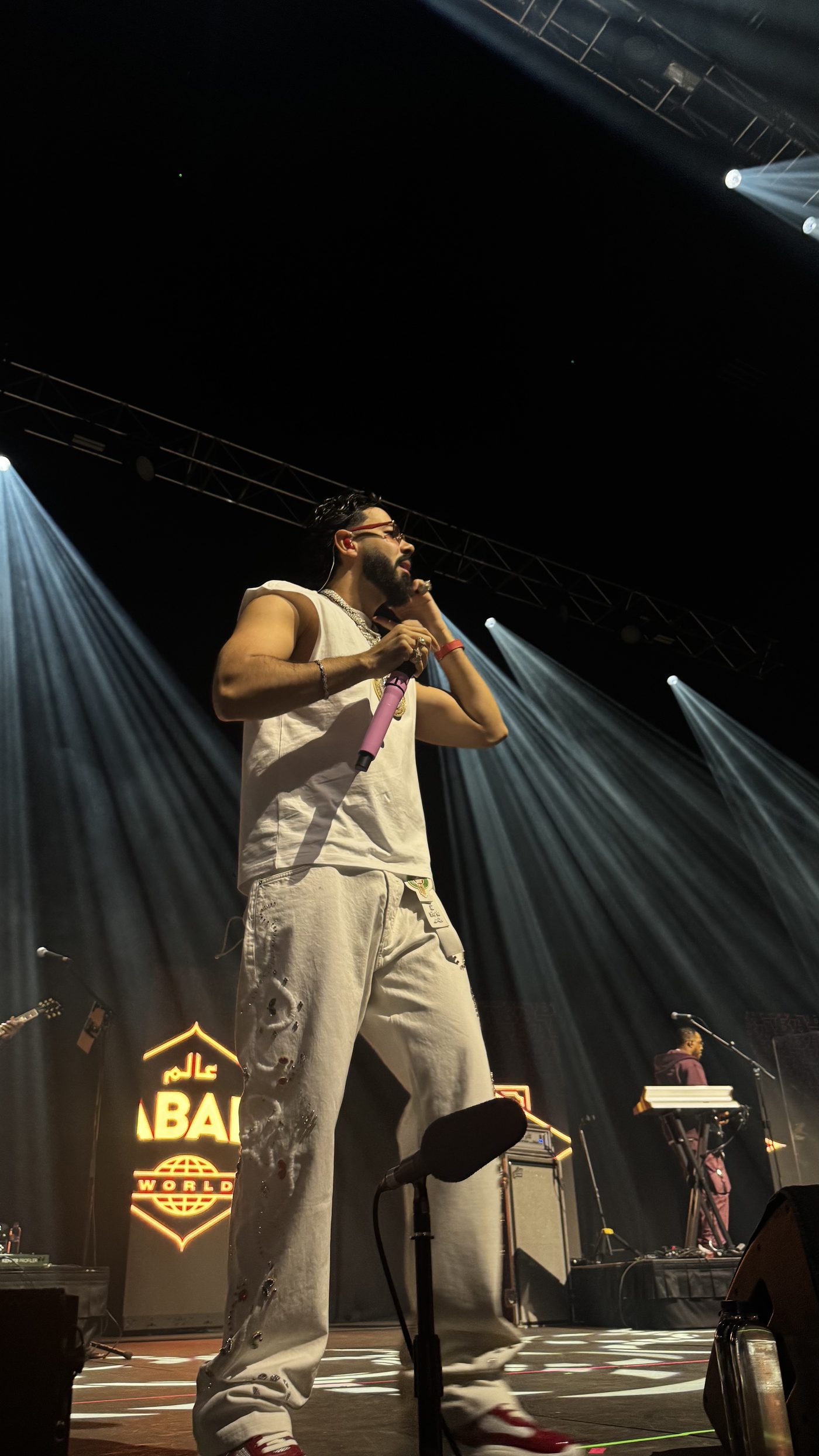 Artist performing on stage at a LLEGGO-run show